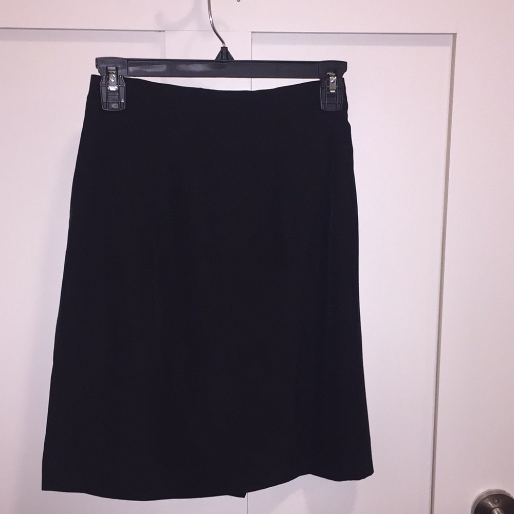Women’s petite black silk skirt.